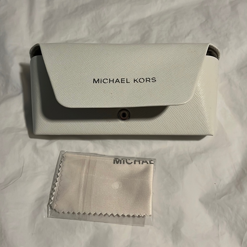 White Michael Kors designer glasses case and lens wipe still in sealed package.